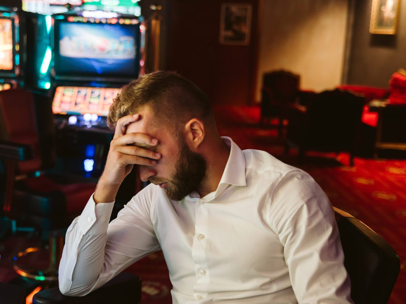 tired or stressed man at a casino - substitute addiction
