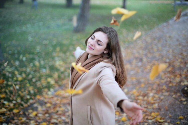 women falling leaves autumn happy sobriety