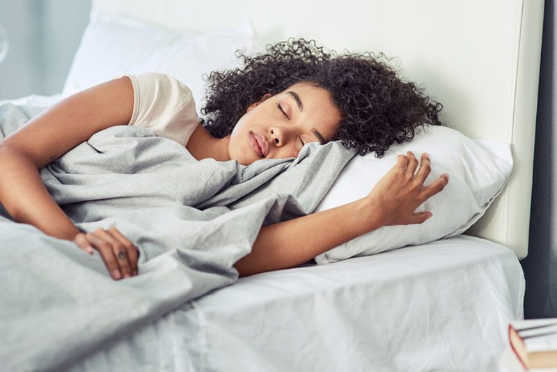 woman sleeping peacefully in bed