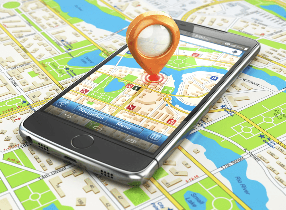 Image of a GPS app on a phone on top of a map.