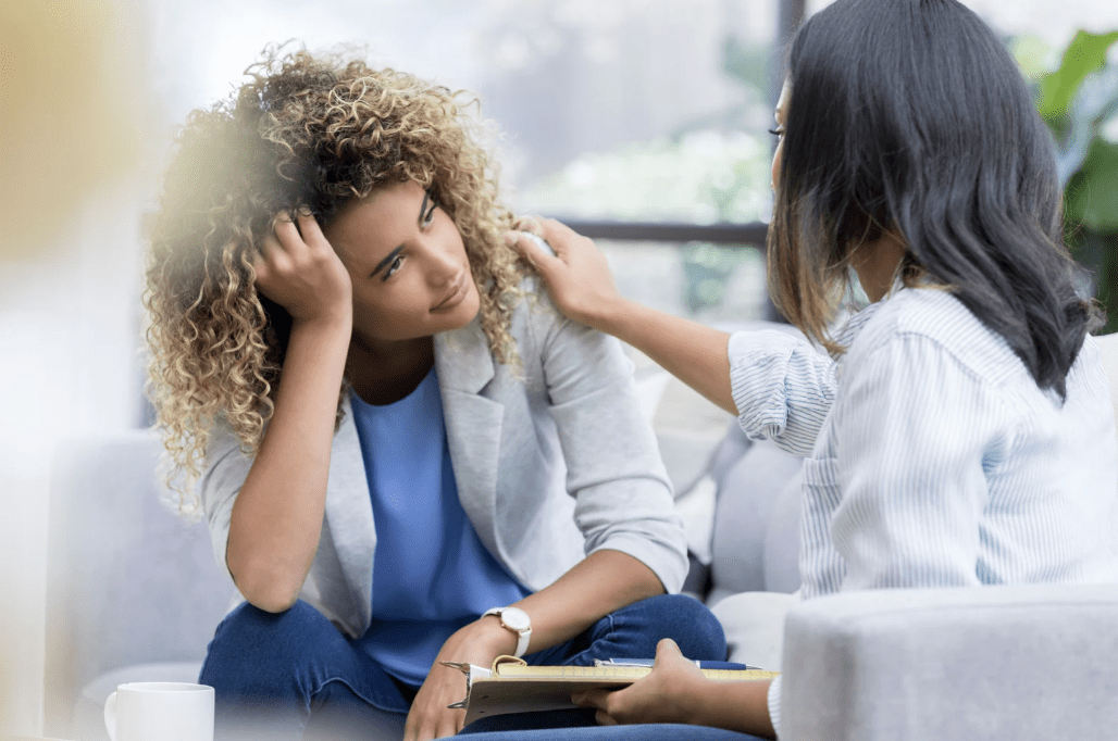 Two women talking.